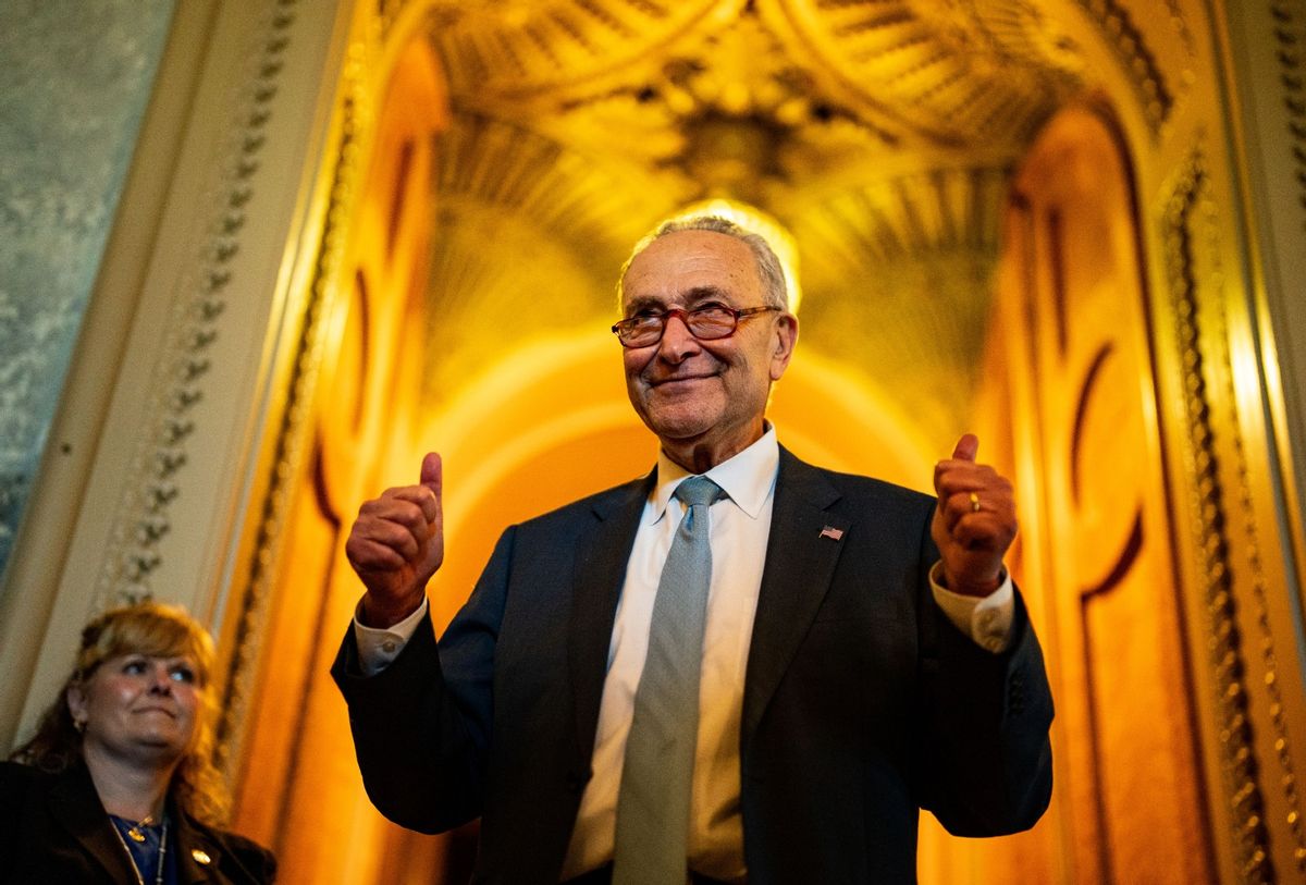 Senate Majority Leader Chuck Schumer (D-NY) gestures, walking out of the Senate Chamber, celebrating the passage of the Inflation Reduct Act at the U.S. Capitol on Sunday, Aug. 7, 2022 in Washington, DC. (Kent Nishimura / Los Angeles Times via Getty Images)