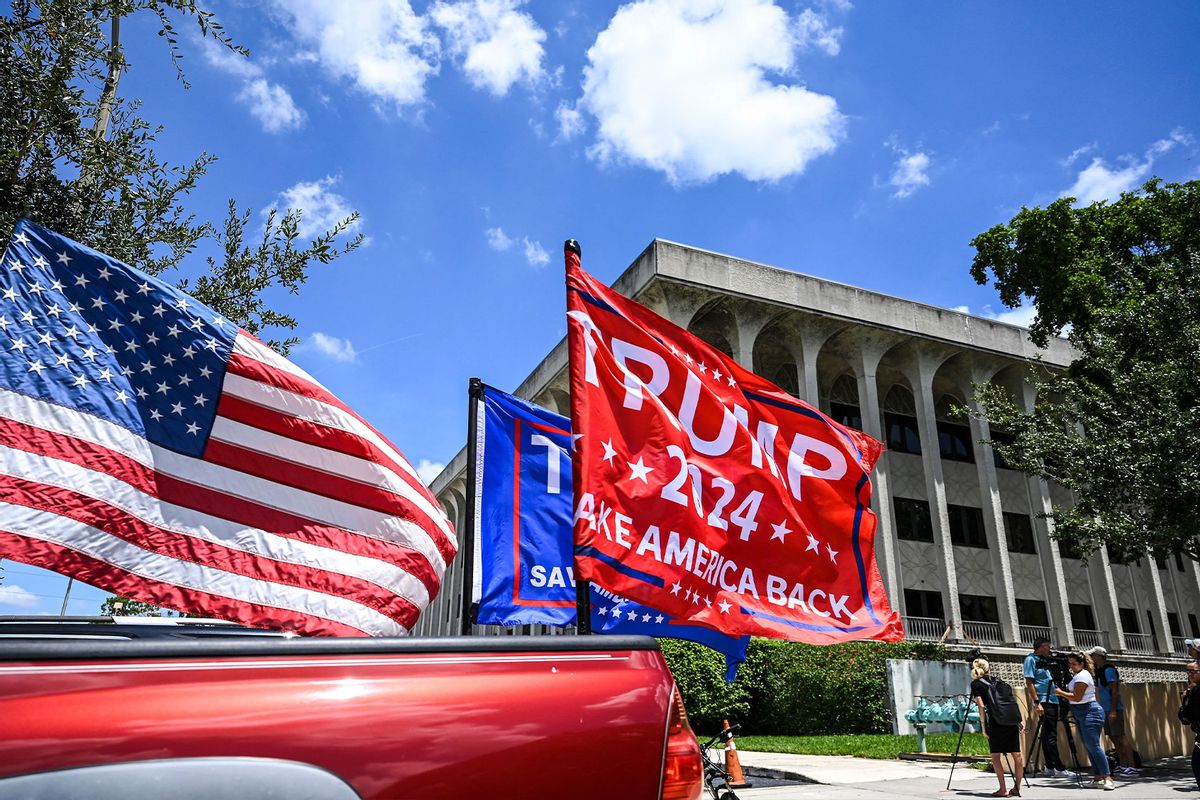 Supporters of former US President Donald Trump drive around the US District Courthouse for the Southern District of Florida in West Palm Beach, Florida on August 18, 2022. (CHANDAN KHANNA/AFP via Getty Images)