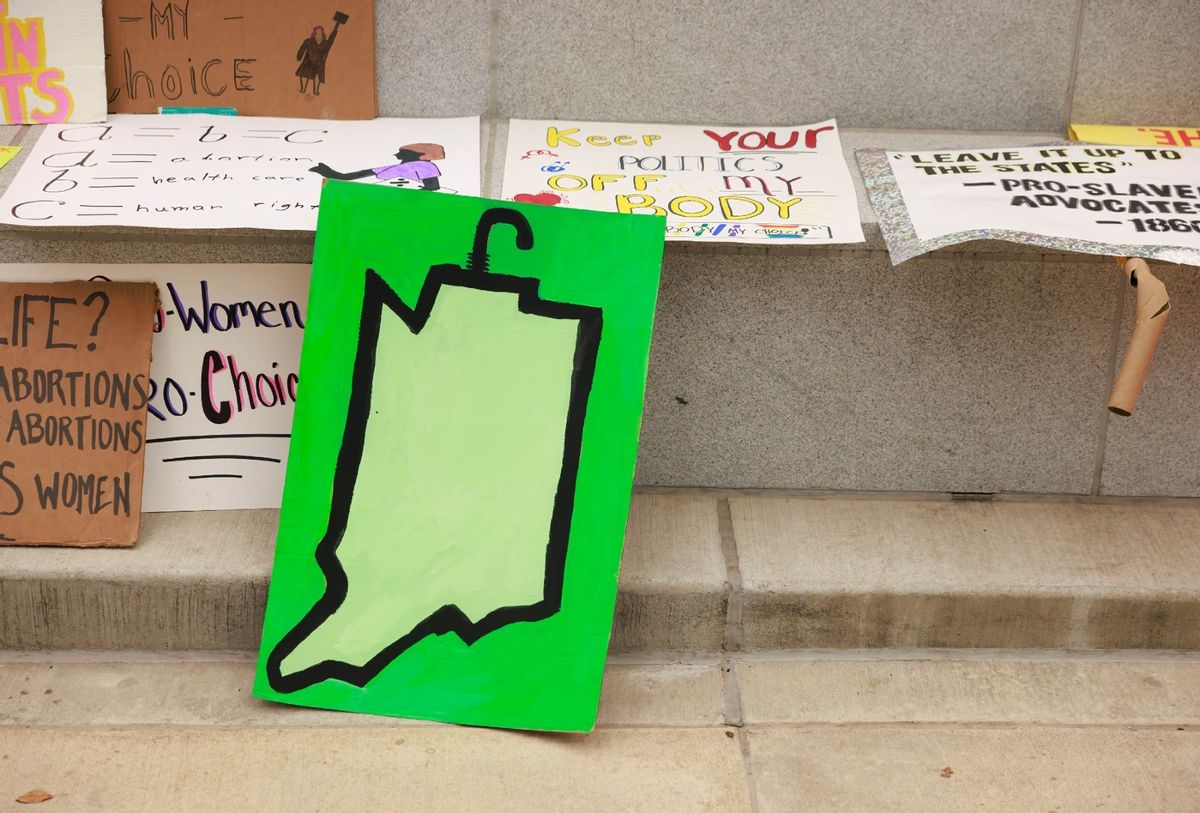 Abortion-rights protesters leave a drawing of the state of Indiana during a demonstration. (Jeremy Hogan/SOPA Images/LightRocket via Getty Images)