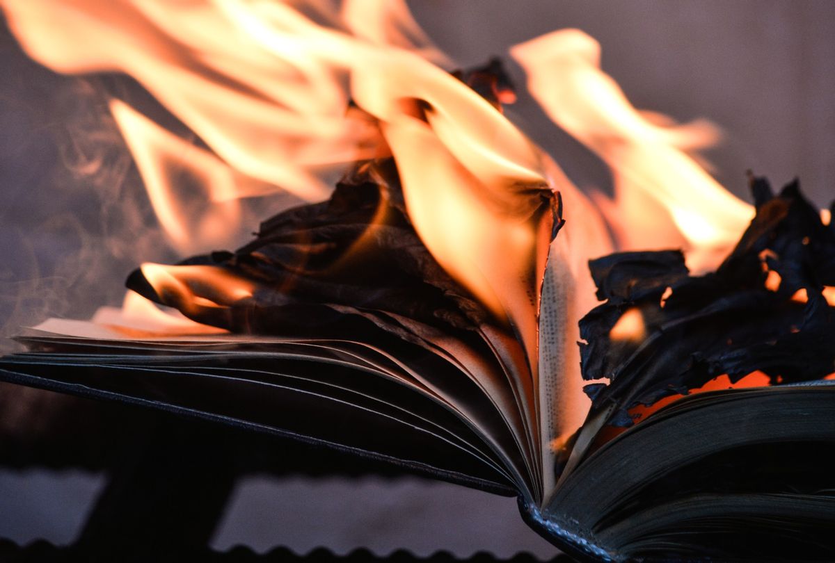 Close-Up Of Burning Book On A Bench. (Valentina Morozova / EyeEm / Getty Images)
