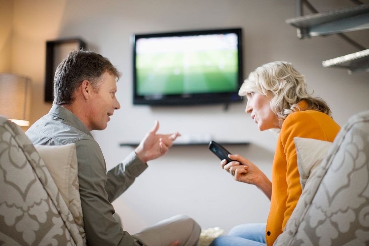 Couple arguing over remote control (Getty Images/Zero Creatives)