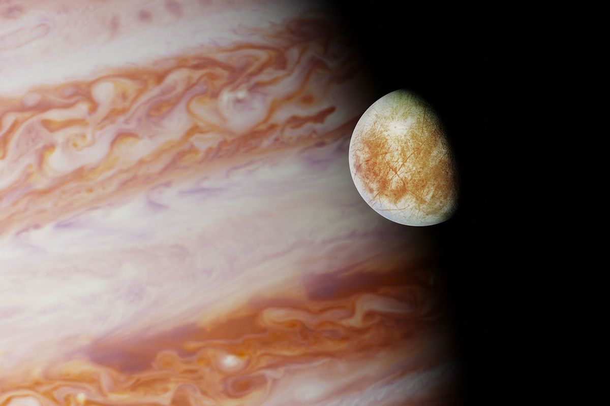 Jupiter's moon Europa in front of the planet Jupiter (Getty Images/dottedhippo)
