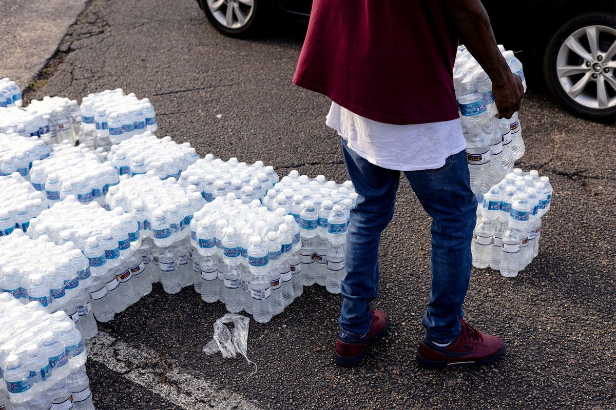 Cases of bottled water are handed out at a Mississippi Rapid Response Coalition distribution site on August 31, 2022 in Jackson, Mississippi. (Brad Vest/Getty Images)