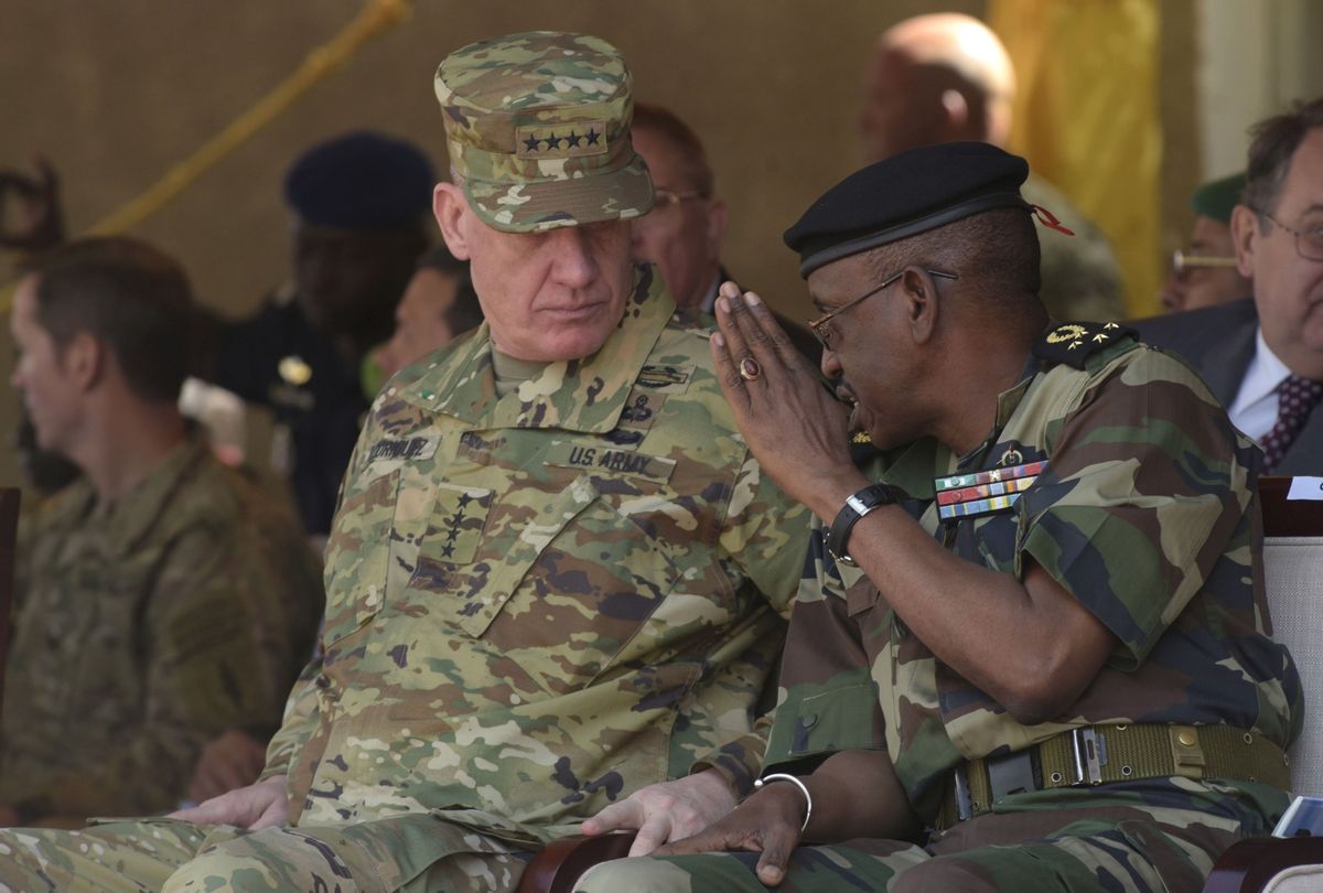 Senegalese Chief of Staff Mamadou Sow (R) speaks with former AFRICOM chief General David Rodriguez during three-week joint military exercise between African, US and European troops, known as Flintlock, on February 29, 2016 in Saint Louis.  (SEYLLOU/AFP via Getty Images)