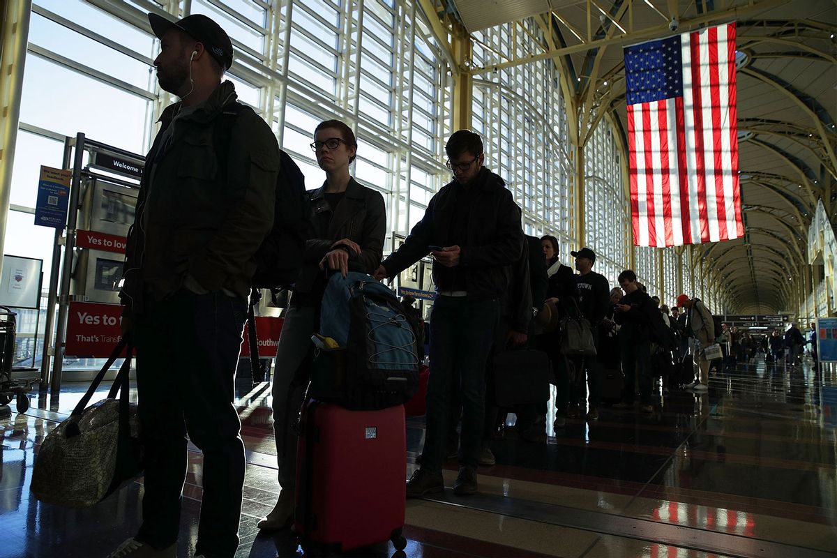 Travelers wait in line for entering the security check at Ronald Reagan Washington National Airport in Arlington, Virginia. (Alex Wong/Getty Images)