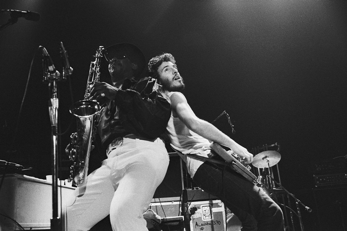 Musician Bruce Springsteen performs at the Trenton War Memorial, Trenton, New Jersey, November 1974. With him is bandmate Clarence Clemmons. (Allan Tannenbaum/Getty Images)