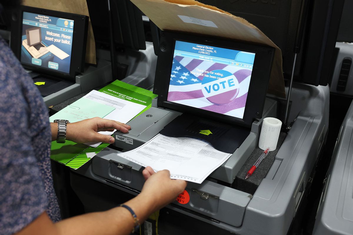 A Miami-Dade election official with the Miami-Dade County Elections Department conducts a comprehensive examination of the voting equipment that will be used in the November 8th general election on October 19, 2022 in Miami, Florida. (Joe Raedle/Getty Images)