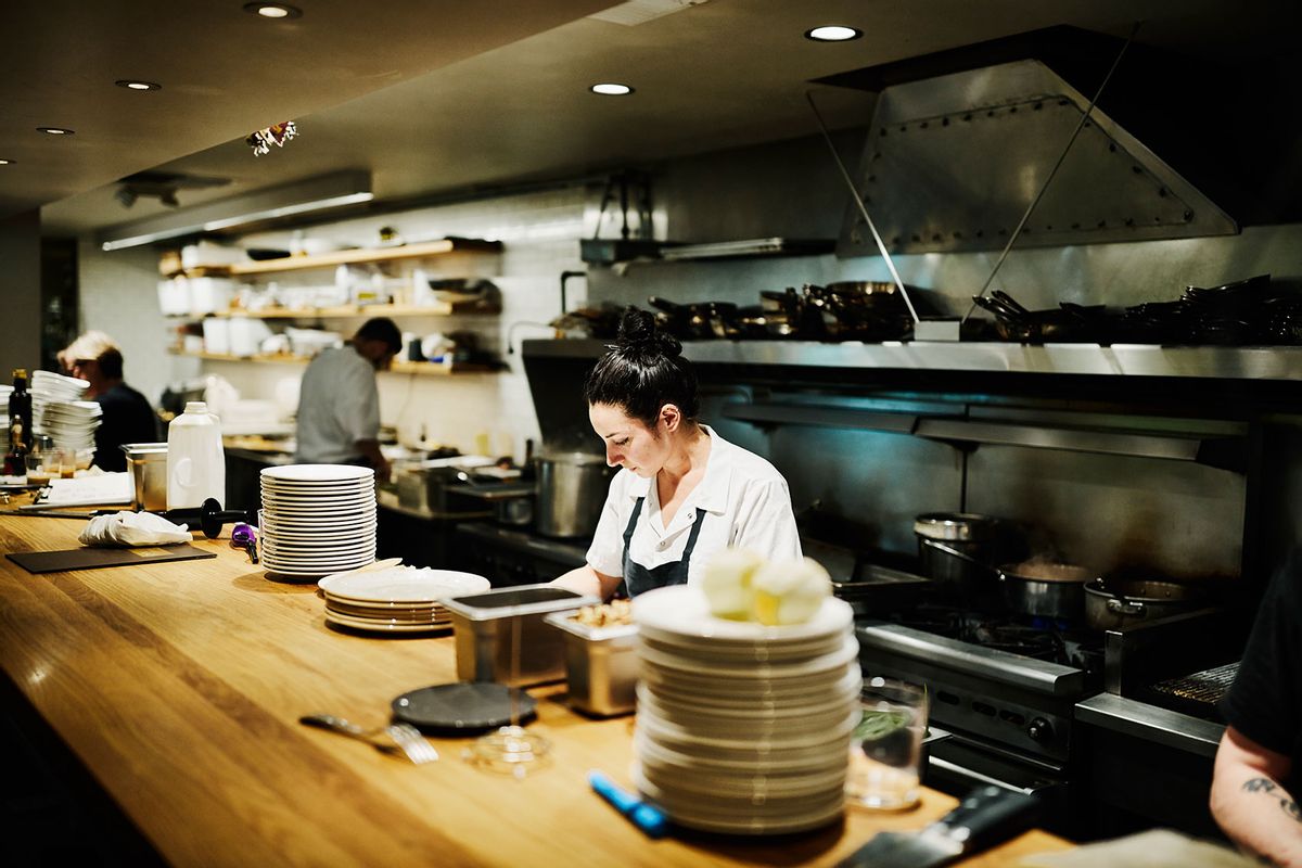 Female chef working in restaurant kitchen (Getty Images/Thomas Barwick)