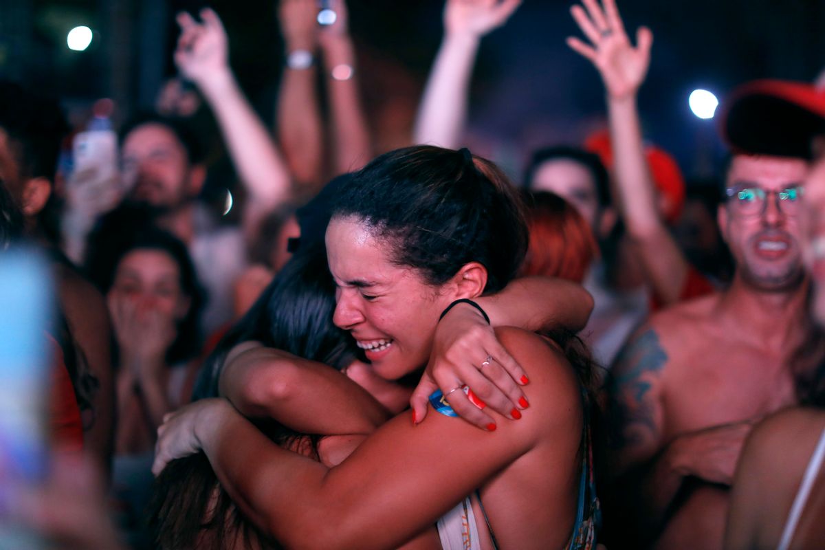 Supporters of Luiz Inácio Lula da Silva break into tears as official vote count shows him as the winner of Brazil's presidential runoff election on Oct. 30, 2022, in Rio de Janeiro. (Joao Laet/Getty Images)