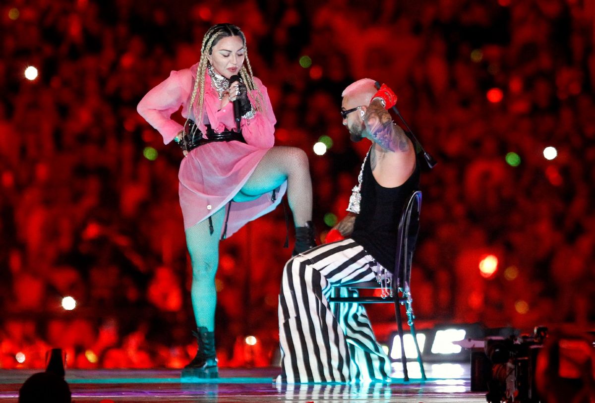 Colombian singer Maluma (R) performs on stage along with pop icon Madonna during his concert "Medallo in the Map", in Medellin, Colombia, on April 30, 2022.  (FREDY BUILES/AFP via Getty Images)
