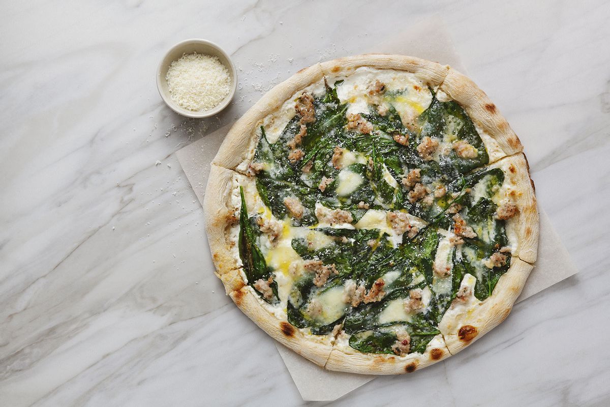 Pizza with chopped meat, spinach and cream sauce (Getty Images/Eugene Mymrin)
