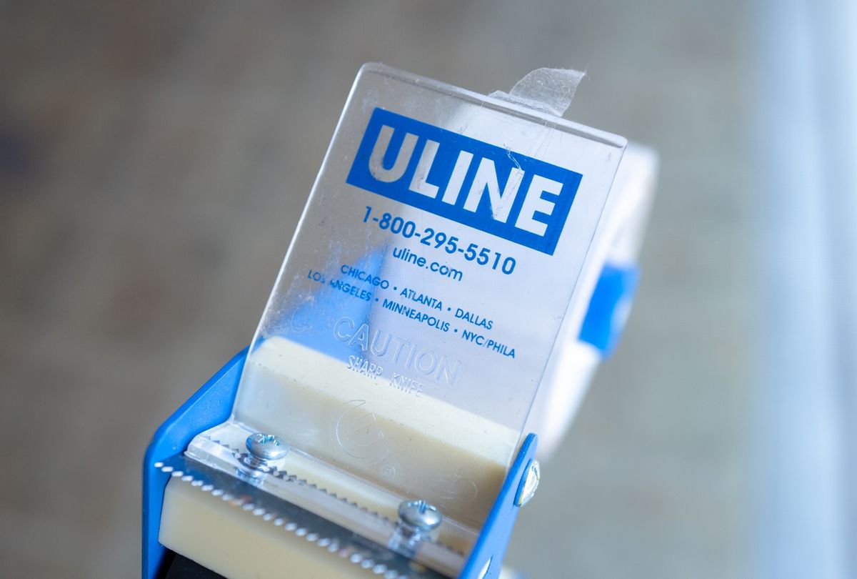 Close-up of logo for shipping and logistics supply company Uline on packing tape dispenser. (Smith Collection/Gado/Getty Images)