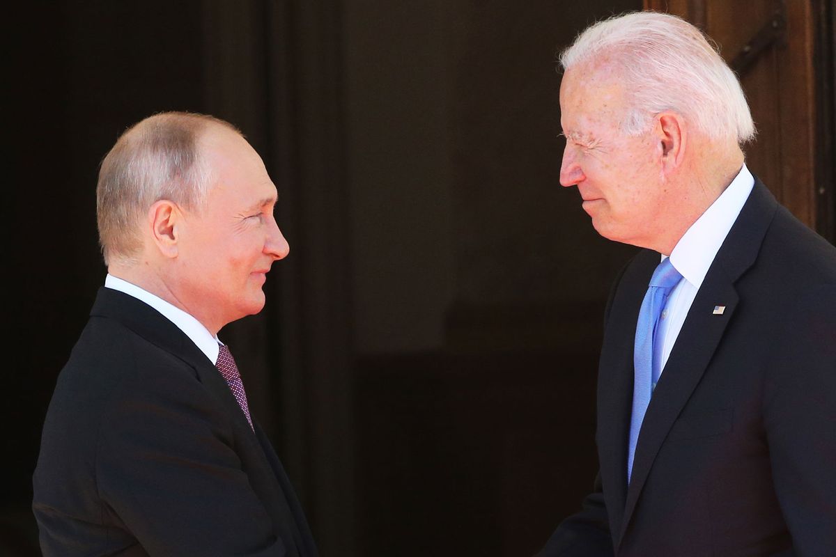 Russian President Vladimir Putin (L) greets US President Joe Biden (R) during the US - Russia Summit 2021 on June 16, 2021 in Geneva, Switzerland. (Mikhail Svetlov/Getty Images)