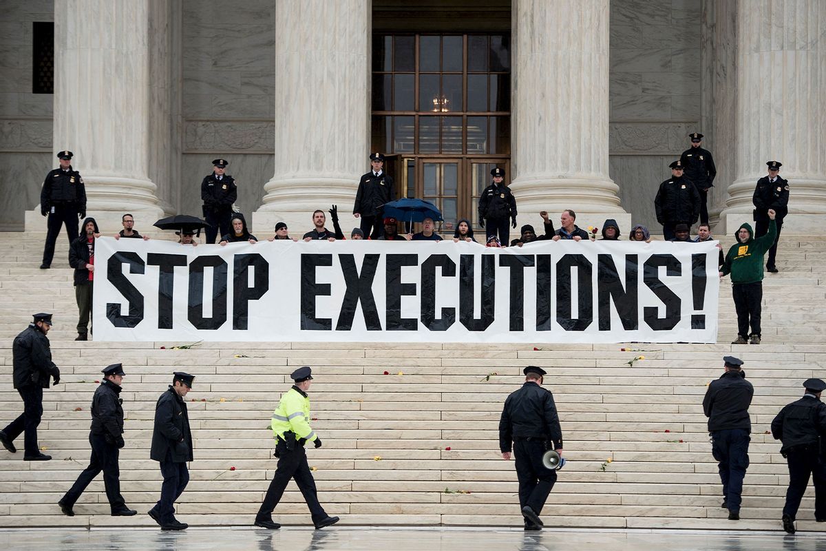 Police officers gather to remove activists during an anti-death penalty protest in front of the US Supreme Court January 17, 2017 in Washington, DC. (BRENDAN SMIALOWSKI/AFP via Getty Images)