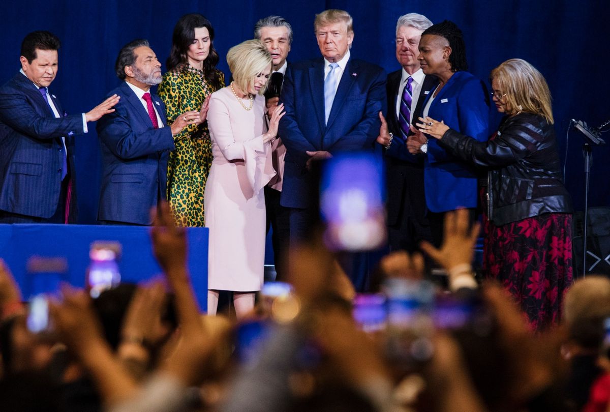 Local religious leaders pray alongside President Donald Trump at the King Jesus International Ministry during an "Evangelicals for Trump" rally in Miami, FL on Friday, Jan. 3, 2020.  (Scott McIntyre/For The Washington Post via Getty Images)
