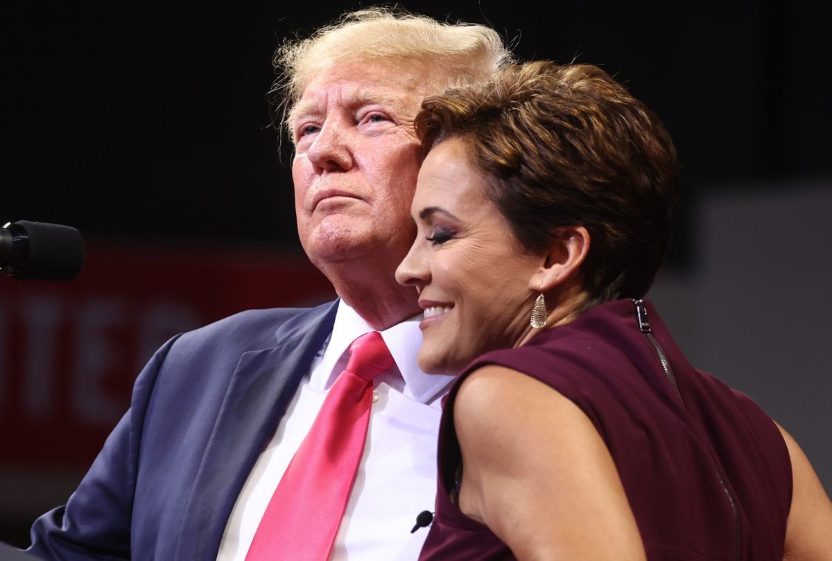 Former President Donald Trump embraces Republican candidate for governor Kari Lake at a "Save America" rally on July 22, 2022 in Prescott Valley, Arizona.  (Mario Tama/Getty Images)