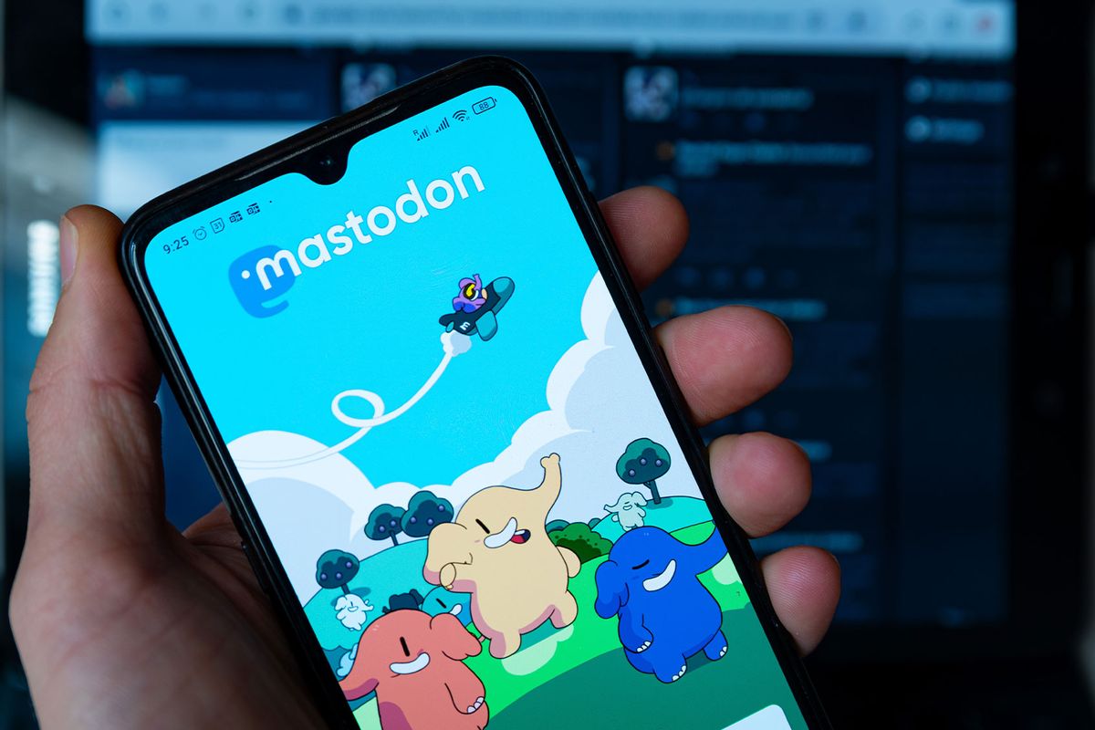 In this photo illustration, Mastodon homepage is seen displayed on a mobile phone screen held by hand. (Photo Illustration by Davide Bonaldo/SOPA Images/LightRocket via Getty Images)