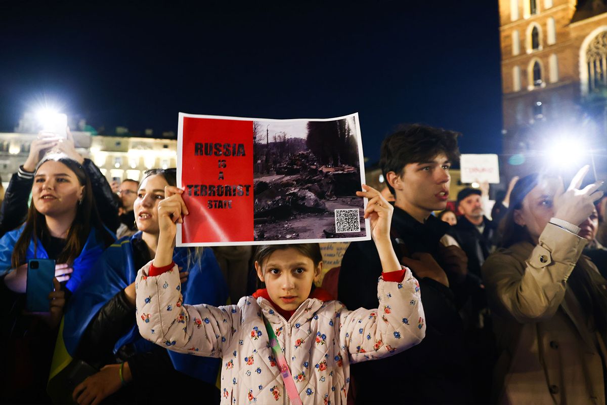 Ukrainian citizens and supporters attend a demonstration of solidarity with Ukraine at the Main Square, after latest Russian missiles targeted civilian infrastructure in several cities in Ukraine. (Beata Zawrzel/NurPhoto via Getty Images)