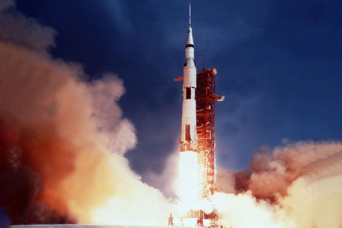 Apollo 11 rises past the launch tower pad 39A to begin Man's first lunar landing mission, Kennedy Space Center, July 16, 1969 (Photo12/UIG/Getty Images)