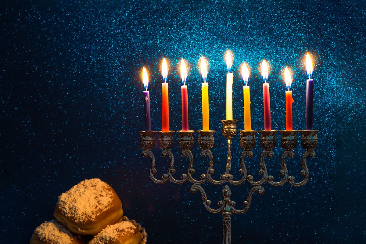Hanukkah Menorah with all candles burning bright (Getty Images/zilber42)