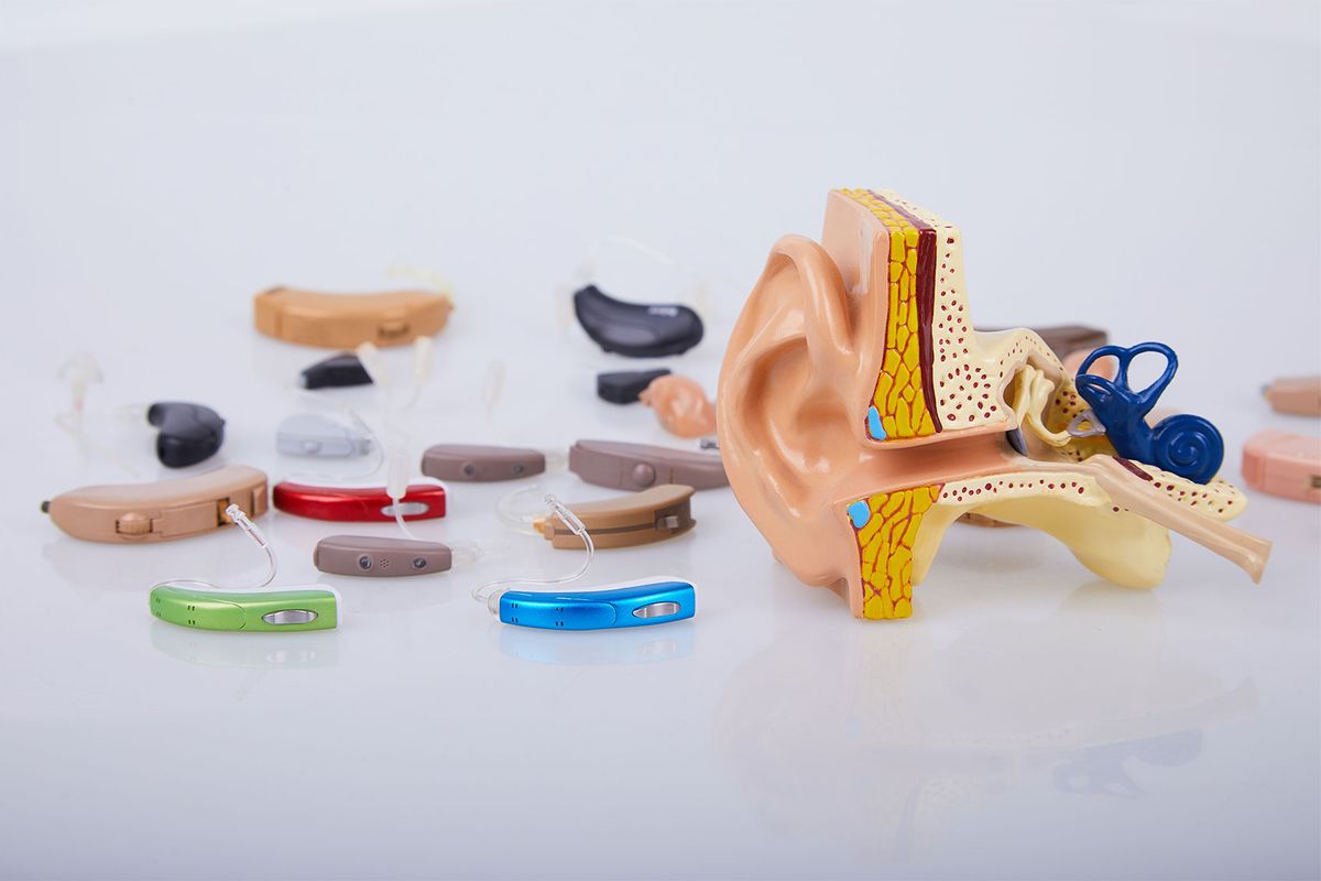 Hearing aids and an artificial human ear model (Getty Images/Liudmyla Liudmyla)