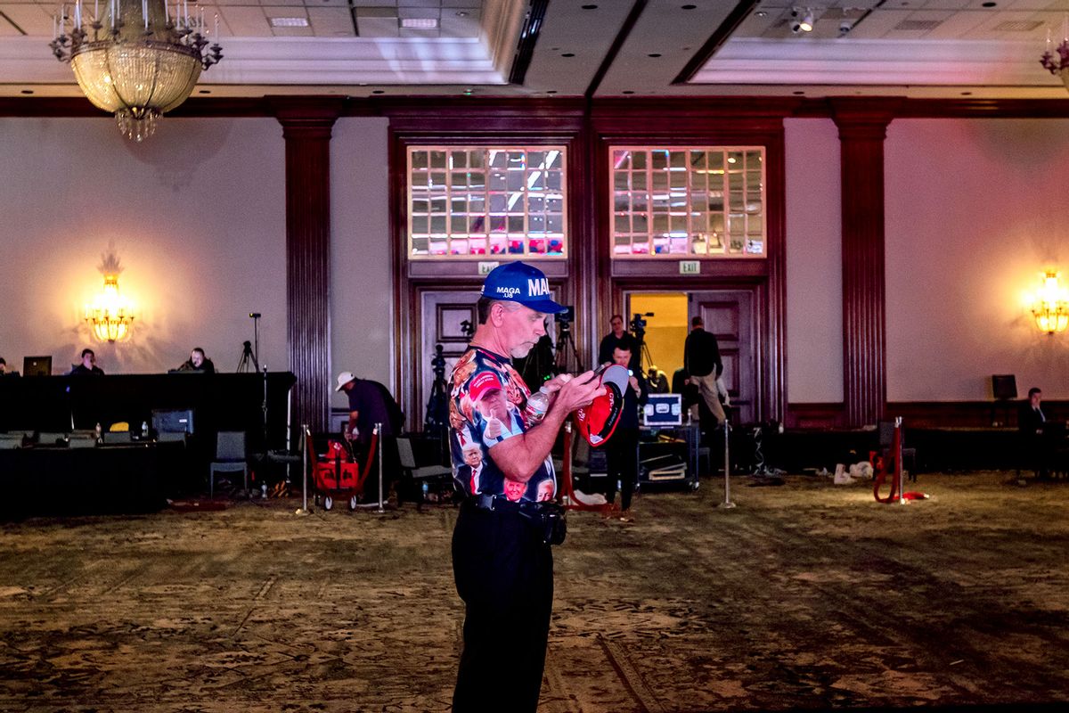 A die-hard Republican wearing a MAGA hat and Trump shirt is one of the last Kari Lake supporters in the ballroom on Election night where Lake was in a close battle with Democratic challenger Kate Hobbs for governor of Arizona on November 8, 2022 in Scottsdale, Arizona. (Gina Ferazzi / Los Angeles Times via Getty Images)