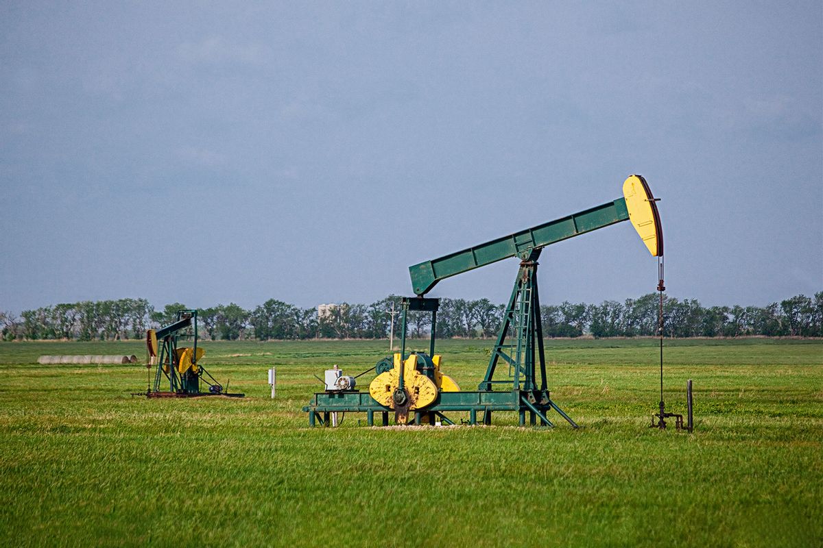 A pair of oil jacks pump crude oil from a Kansas prairie (Getty Images/Keith Szafranski)