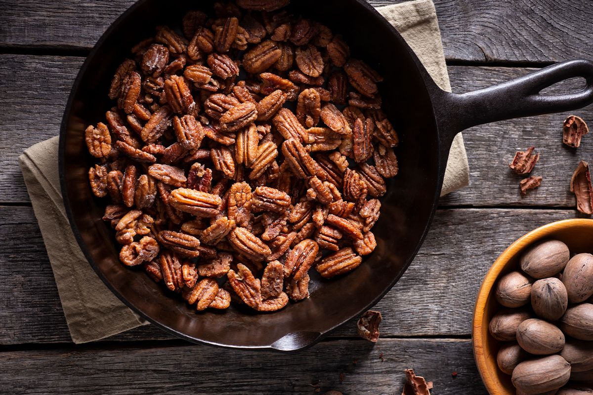 Fresh Glazed Pecans in a Cast Iron Skillet (Getty Images/rudisill)