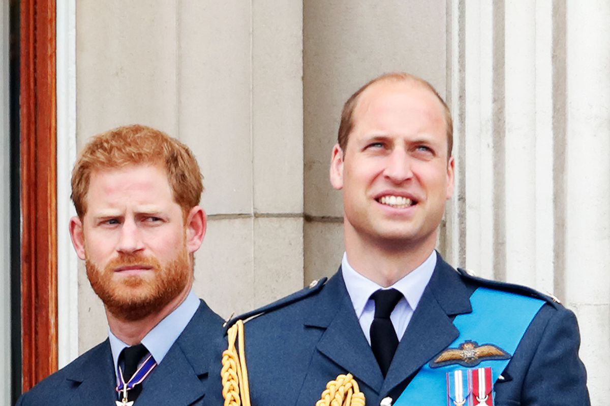 Prince Harry, Duke of Sussex and Prince William, Duke of Cambridge watch a flypast to mark the centenary of the Royal Air Force from the balcony of Buckingham Palace on July 10, 2018 in London, England. (Max Mumby/Indigo/Getty Images)