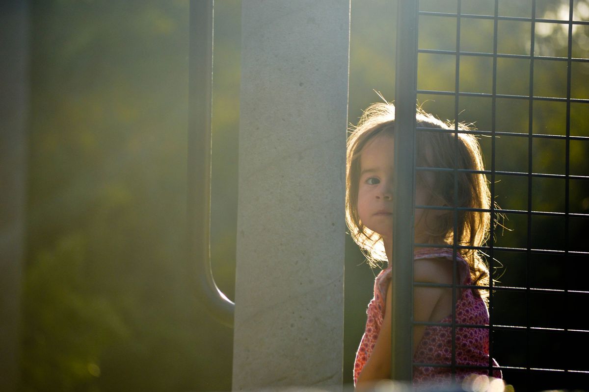 Sad little girl at the park (Getty Images/Fran Polito)