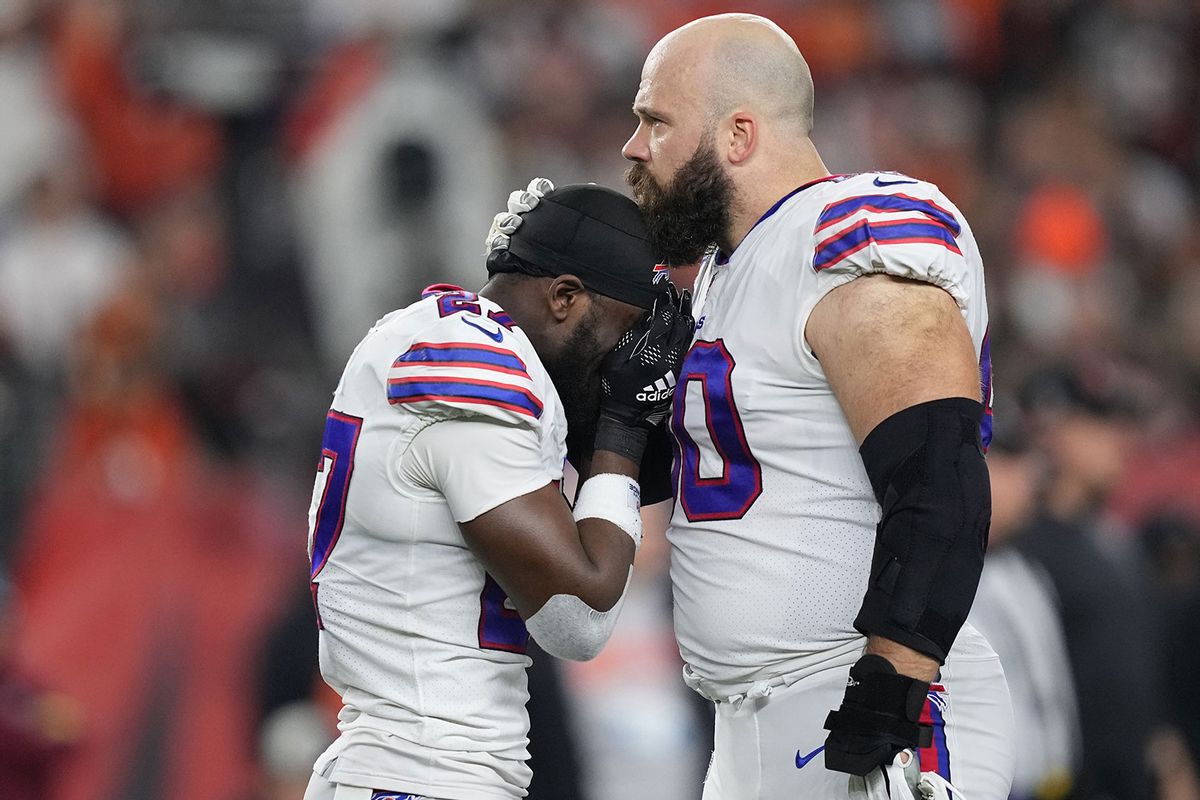 Tre'Davious White (left) and Mitch Morse of the Buffalo Bills react to teammate Damar Hamlin collapsing after making a tackle against the Cincinnati Bengals at Paycor Stadium in Cincinnati, Jan. 2, 2023. (Dylan Buell/Getty Images)