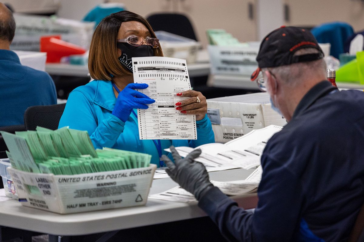 Election workers sort ballots at the Maricopa County Tabulation and Election Center on November 09, 2022 in Phoenix, Arizona. (John Moore/Getty Images)