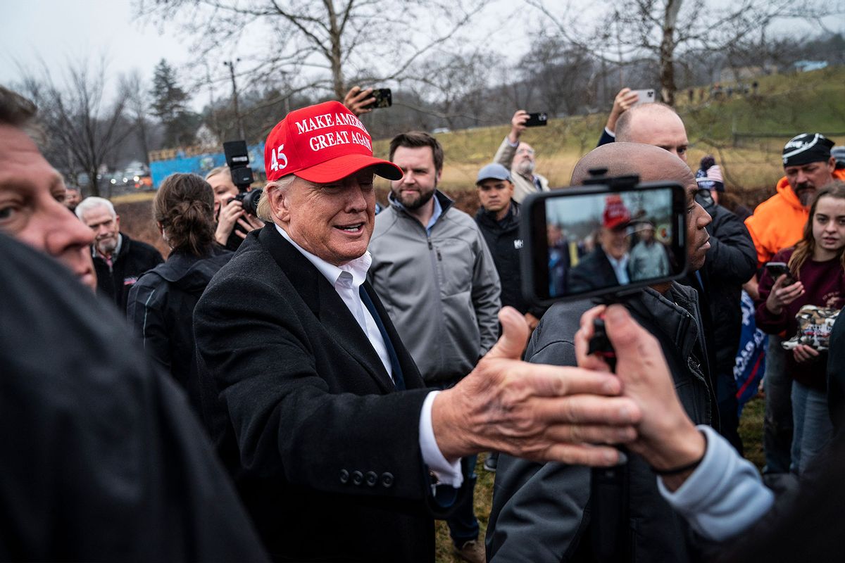 Former President Donald Trump, with Sen. JD Vance, R-Ohio, greets supporters while touring Little Beaver Creek and water pumps during a visit to East Palestine, Ohio, following the Feb. 3 Norfolk Southern freight train derailment on Wednesday, Feb. 22, 2023, in East Palestine, Ohio. (Jabin Botsford/The Washington Post via Getty Images)