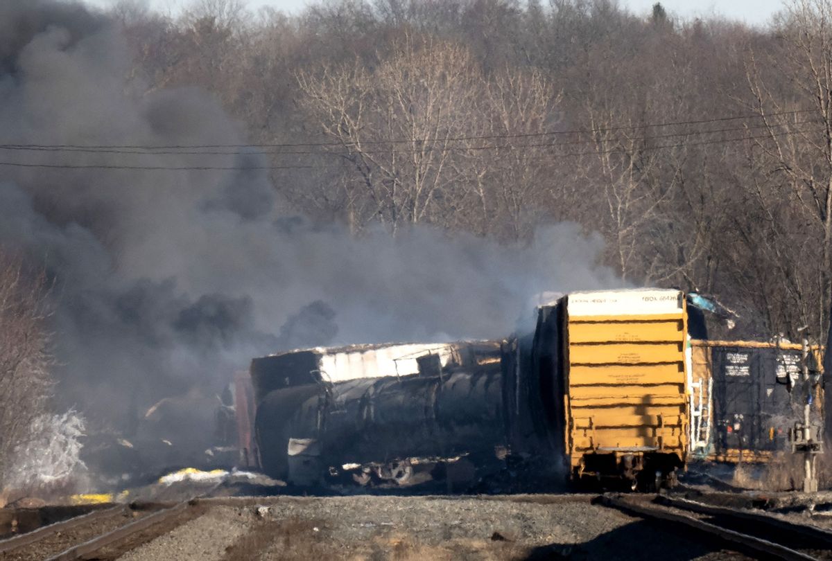 Smoke rises from a derailed cargo train in East Palestine, Ohio, on February 4, 2023. - The train accident sparked a massive fire and evacuation orders, officials and reports said Saturday. No injuries or fatalities were reported after the 50-car train came off the tracks late February 3 near the Ohio-Pennsylvania state border.  (DUSTIN FRANZ/AFP via Getty Images)