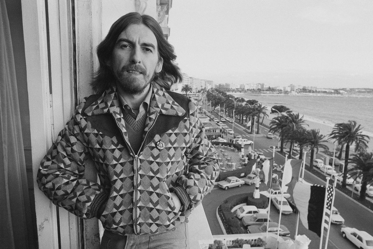 English singer-songwriter, guitarist and former Beatle, George Harrison (1943 - 2001) on a hotel balcony in Cannes, France, 30th January 1976. (Michael Putland/Getty Images)