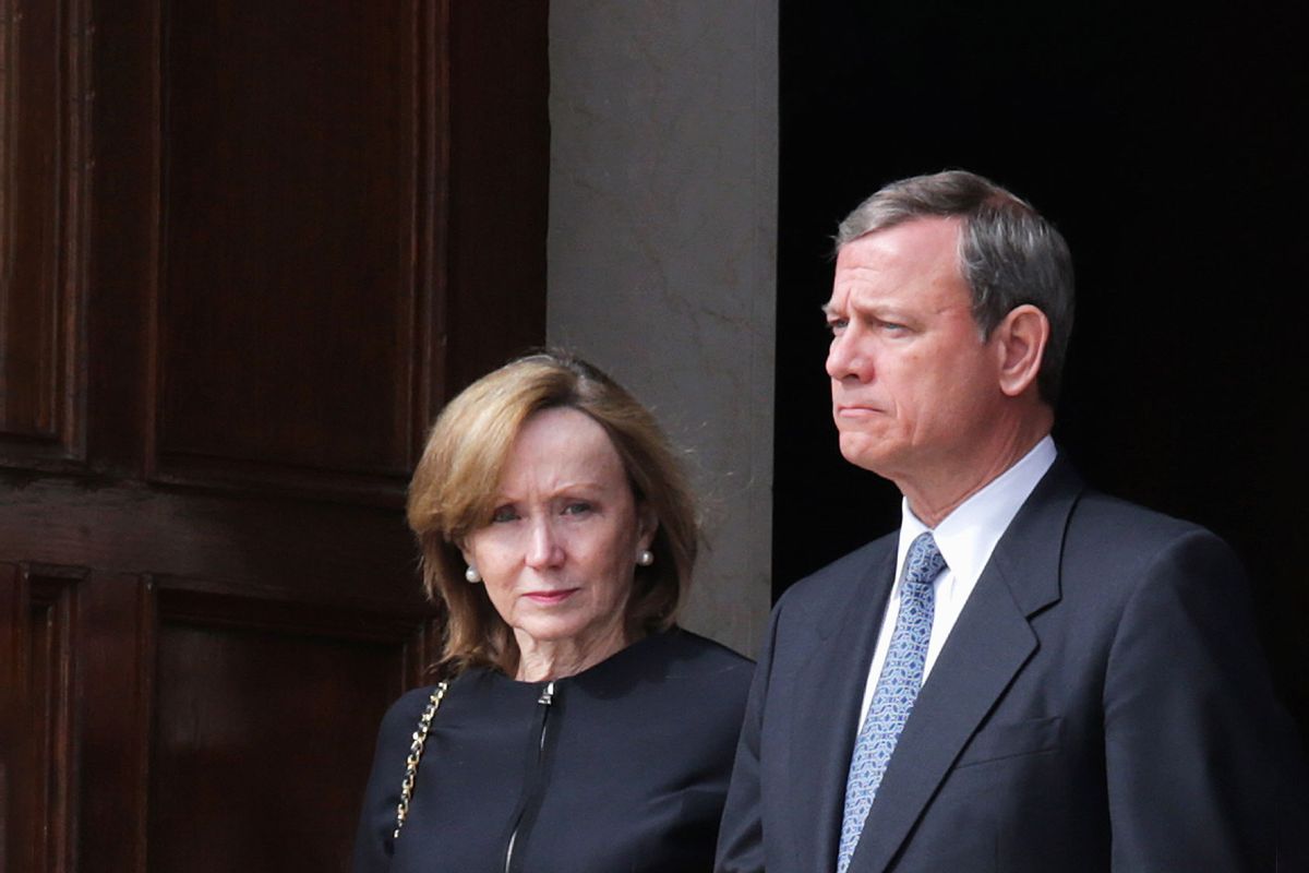 U.S. Supreme Court Chief Justice John Roberts (R) and his wife Jane Roberts leave the Basilica of the National Shrine of the Immaculate Conception following the funeral of Associate Justice Antonin Scalia February 20, 2016 in Washington, DC. (Chip Somodevilla/Getty Images)
