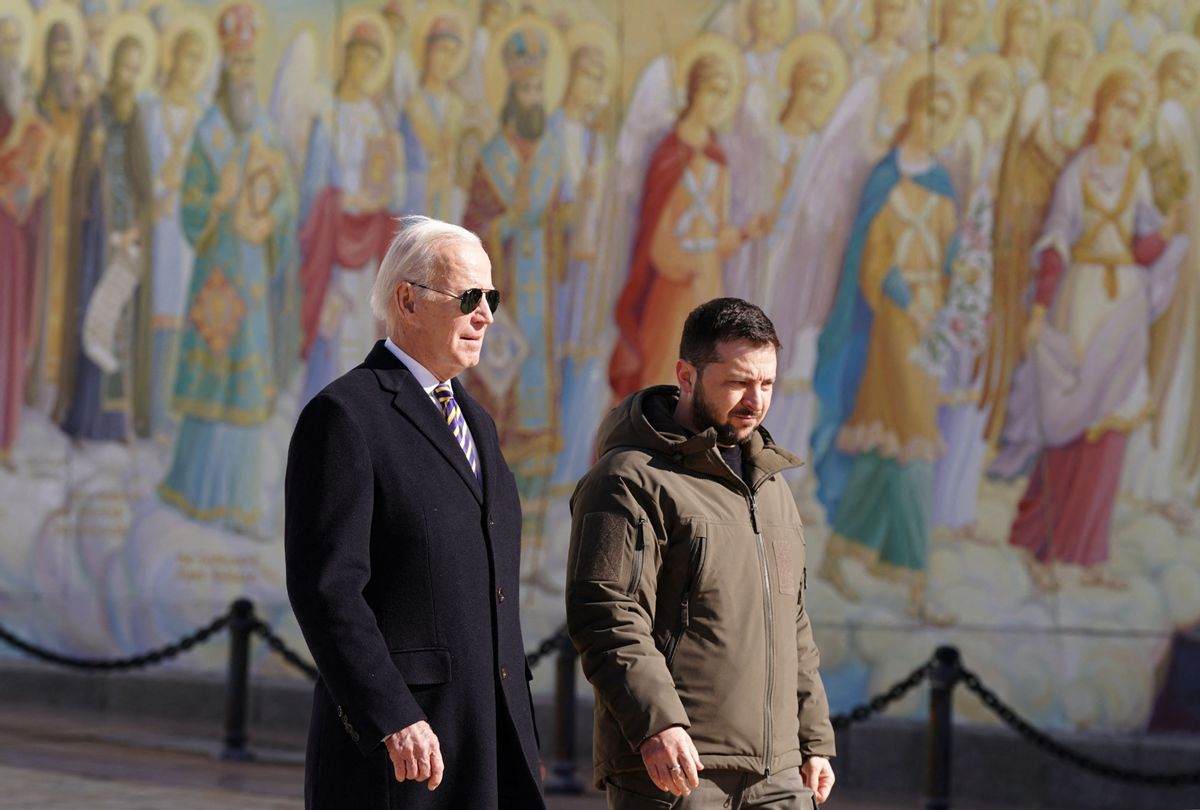 President Joe Biden walks next to Ukrainian President Volodymyr Zelenskyy past a religious mural at the St. Michaels Golden-Domed Cathedral, as he arrives for a visit in Kyiv on February 20, 2023.  (DIMITAR DILKOFF/AFP via Getty Images)
