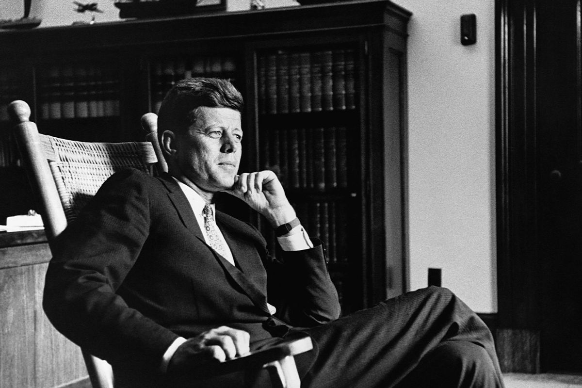 President John F. Kennedy (1917-1963), thirty-fifth president of the United States, relaxes in his trademark rocking chair in the Oval Office. (CORBIS/Corbis via Getty Images)