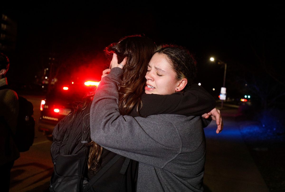 Michigan State University students hug during an active shooter situation on campus on February 13, 2023 in Lansing, Michigan.  (Bill Pugliano/Getty Images)