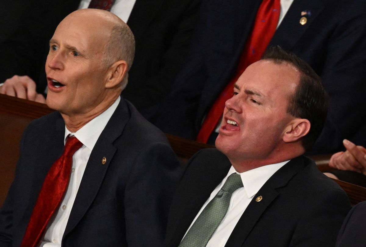 Senators Rick Scott (R-FL) and Mike Lee (R-UT) yell as President Joe Biden delivers the State of the Union address at the US Capitol in Washington, DC, February 7, 2023.  (ANDREW CABALLERO-REYNOLDS/AFP via Getty Images)