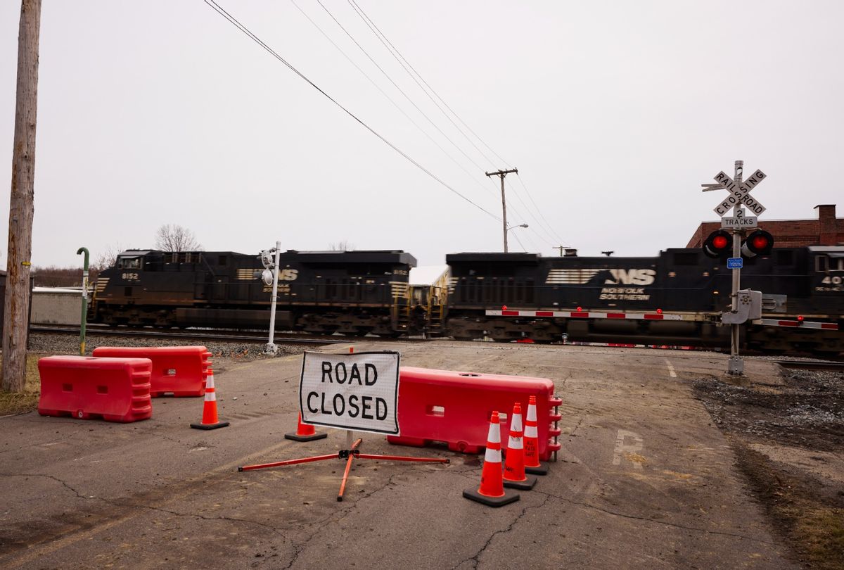 A Norfolk Southern train is en route near where another train by the company derailed, on February 14, 2023 in East Palestine, Ohio. The derailment occurred on February 3, releasing toxic fumes and forcing evacuation of residents.  (Angelo Merendino/Getty Images)