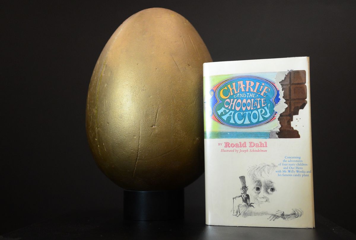 The first edition book "Charlie and the Chocolate Factory" and the original hero Golden Egg from the film "Willy Wonka and the Chocolate Factory" (FREDERIC J. BROWN/AFP/GettyImages)