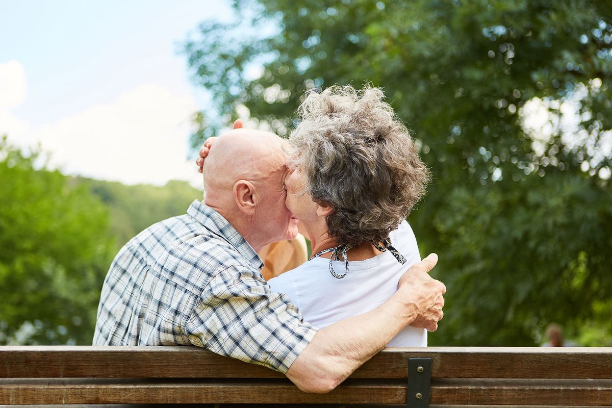 Senior Couple Embracing At Park (Getty Images/Robert Kneschke/EyeEm)