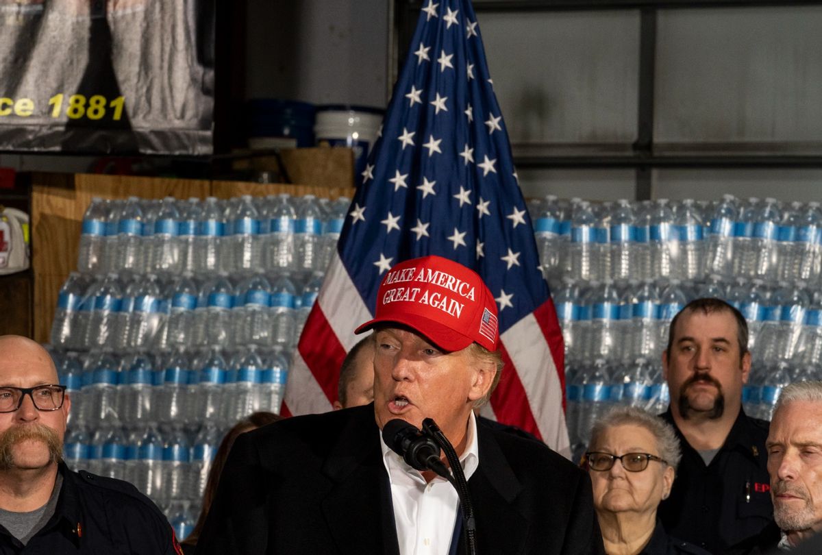 Former President Donald Trump stands next to a pallet of water before delivering remarks at the East Palestine Fire Department station on February 22, 2023 in East Palestine, Ohio.  (Michael Swensen/Getty Images)