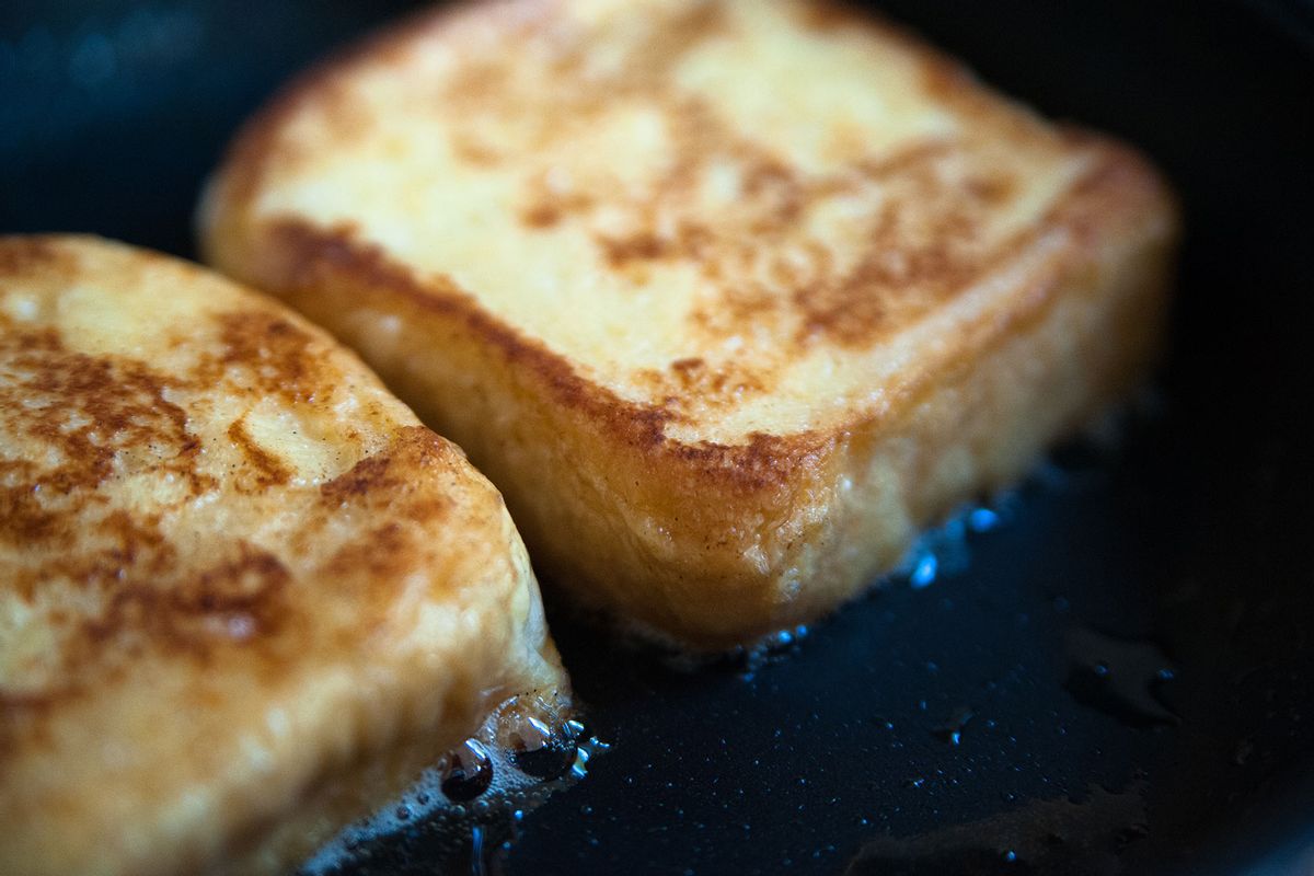 Cooking French toasts on a frying pan (Getty Images/moriyu)