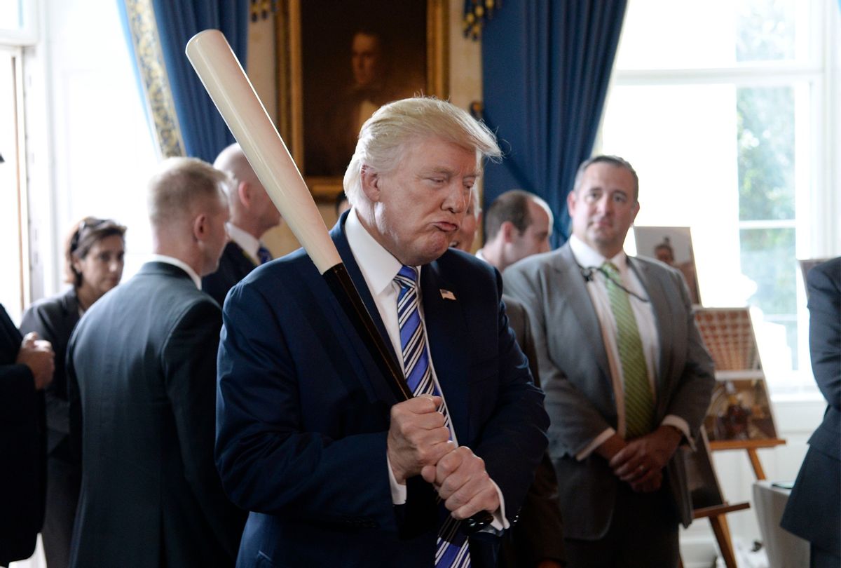 Former President Donald Trump holds a Marucci baseball bat in the Blue Room during a "Made in America" product showcase event at the White House in Washington, DC, on July 17, 2017.  (OLIVIER DOULIERY/AFP via Getty Images)