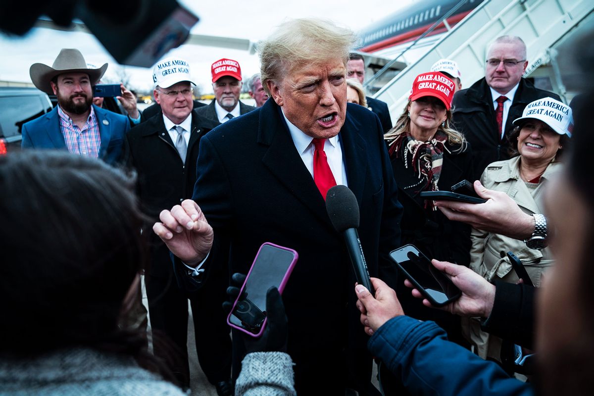 Former President Donald Trump speaks to reporters as he lands at Quad City International Airport in route to Iowa on Monday, March 13, 2023, in Moline, IL. (Jabin Botsford/The Washington Post via Getty Images)