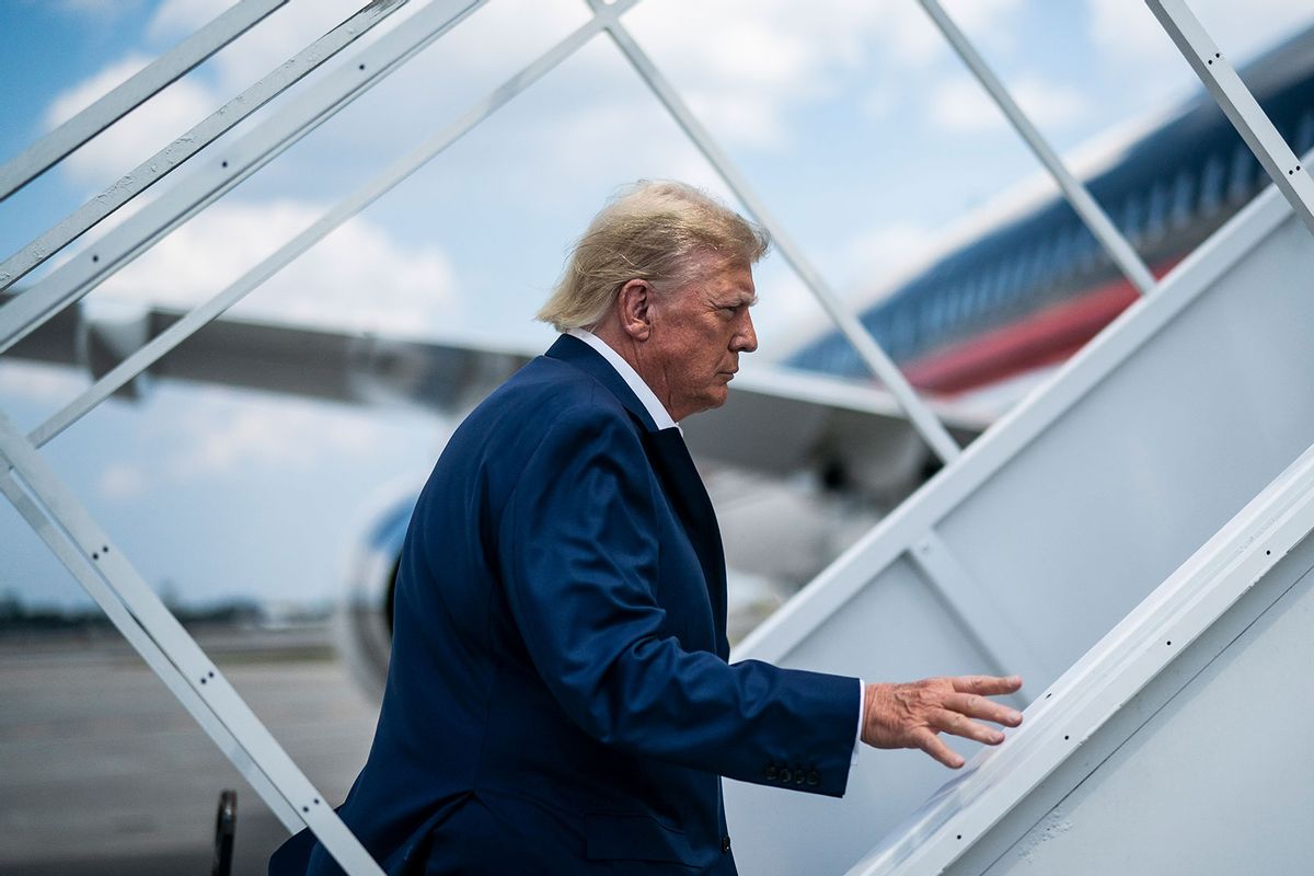 Former President Donald Trump boards his airplane, known as Trump Force One, in route to Iowa at Palm Beach International Airport on Monday, March 13, 2023, in West Palm Beach, FL. (Jabin Botsford/The Washington Post via Getty Images)