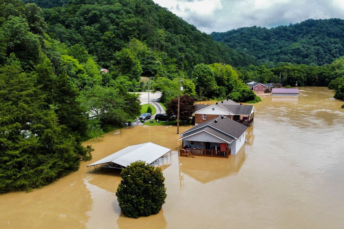 Homes along Gross Loop off of KY-15 are flooded with water from the North Fork of the Kentucky River. (Arden S. Barnes/For The Washington Post via Getty Images)