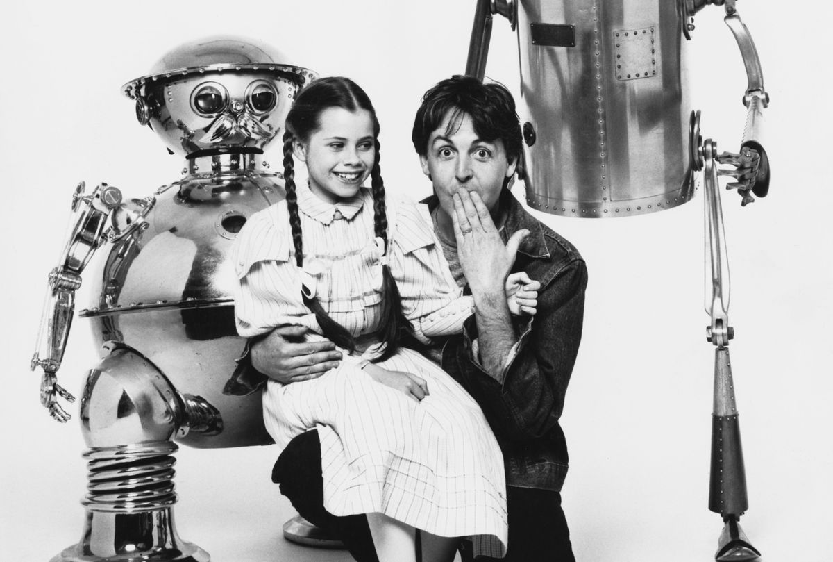 American actress Fairuza Balk poses with English singer, songwriter and musician Paul McCartney, as well as characters Tik-Tok and the Tin Woodman, during the filming of "Return to Oz," 1985 (Richard Blanshard/Getty Images)